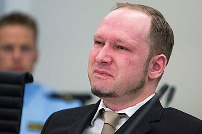Anders Behring Breivik cries as a video of a propaganda video posted by him online is presented by the prosecution is shown in court in Oslo Norway.
