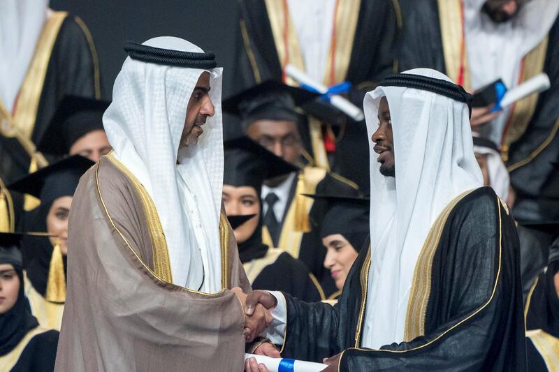 ABU DHABI, UNITED ARAB EMIRATES - October 07, 2018: HH Sheikh Hamed bin Zayed Al Nahyan, Chairman of the Crown Prince Court of Abu Dhabi and Abu Dhabi Executive Council Member (L), presents a certificate to a student during the 2018 Khalifa University Graduation ceremony at the Abu Dhabi National Exhibition Centre (ADNEC).

( Rashed Al Mansoori / Crown Prince Court - Abu Dhabi )
---