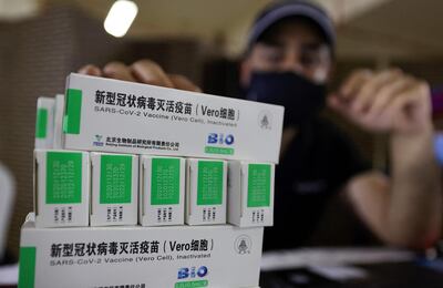 Boxes of China's Sinopharm COVID-19 vaccine are seen during vaccination at the Guru Nanak Darbar Gurudwara (Sikh temple) in Dubai on February 28, 2021.  / AFP / Karim SAHIB
