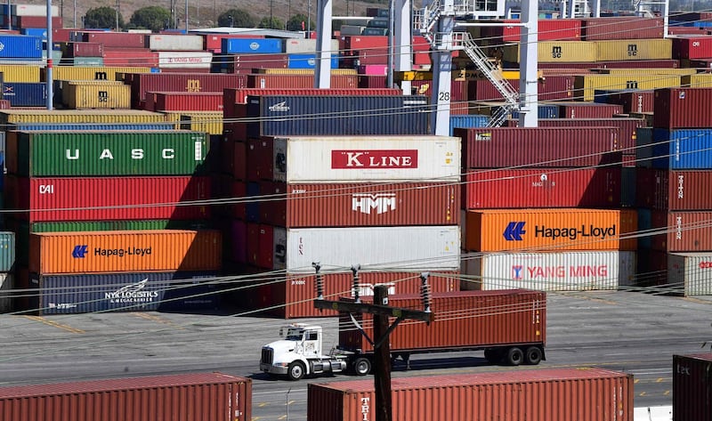 (FILES) In this file photo shipping containers are stacked high at the Port of Los Angeles, California on April 19, 2021. The US trade deficit dialed back in April, as exports rose and imports fell, according to government data released on June 8, 2021. The $68.9 billion deficit in goods and services recorded by the Commerce Department was slightly larger than expected and came as the world's largest economy was bouncing back rapidly from the Covid-19 pandemic, aided by nationwide vaccination campaigns.
 / AFP / Frederic J. BROWN
