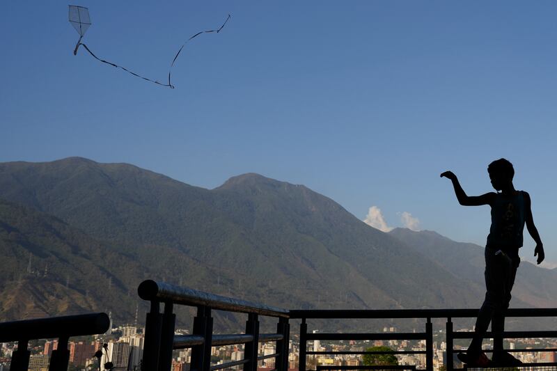 A boy flies a kite in the San Agustin neighborhood in Caracas, Venezuela. AP Photo