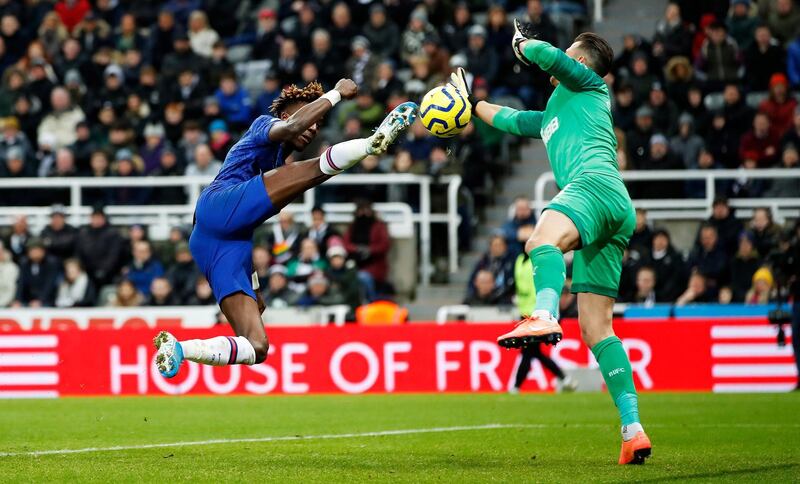 epa08139514 Newcastle United's Martin Dubravka makes a save from Chelsea's Tammy Abraham during the English Premier league soccer match between Newcastle United and Chelsea held at St James' Park stadium in Newcastle, Britain, 18 January 2020.  EPA/LYNNE CAMERON EDITORIAL USE ONLY.  No use with unauthorized audio, video, data, fixture lists, club/league logos or 'live' services. Online in-match use limited to 120 images, no video emulation. No use in betting, games or single club/league/player publications.