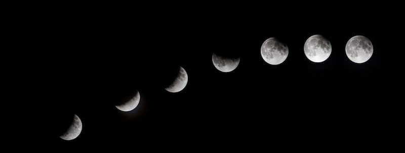 A multiple exposure image shows the phases of the partial lunar eclipse as seen from Mallorca, Spain. EPA/CATI CLADERA