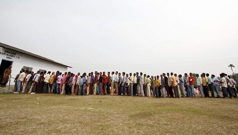 People line up to cast their vote outside a polling station at Dhekiajuli in Sonitpur district in the northeastern Indian state of Assam. Utpal Baruah / Reuter April 7