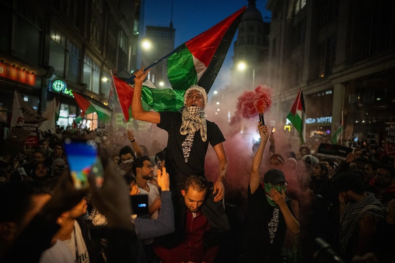 People demonstrate in support of Palestine at the Israeli embassy in London. Getty Images