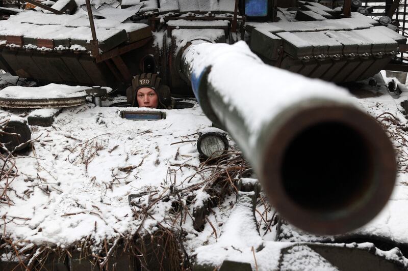 A Ukrainian soldier looks out for danger near Bakhmut. AFP