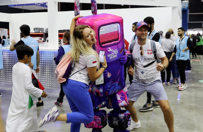 DUBAI , UNITED ARAB EMIRATES , October 26 – 2019 :-  Visitors taking their photos with the mascot at the First Global Challenge robotics competition held at Festival Arena in Dubai.  ( Pawan Singh / The National ) For News. Story by Patrick