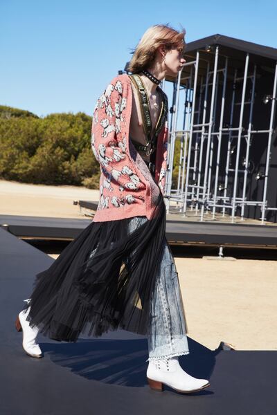 A leather jacket is decorated with metal detailing for Celine's spring / summer show