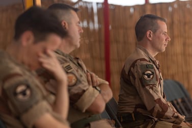 French soldiers pay their respects during a protestant service in Mali for the 13 French soldiers that were killed. EPA