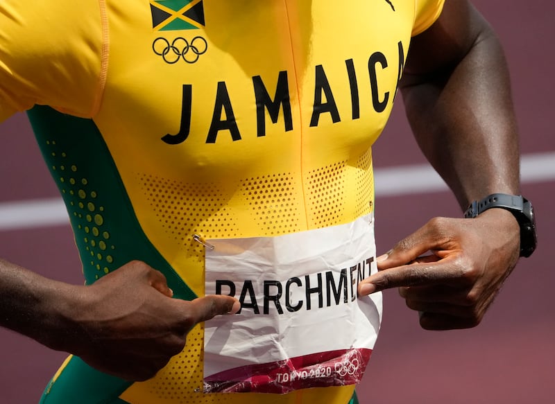Hansle Parchment, of Jamaica celebrates winning the gold medal in the men's 110m hurdles.