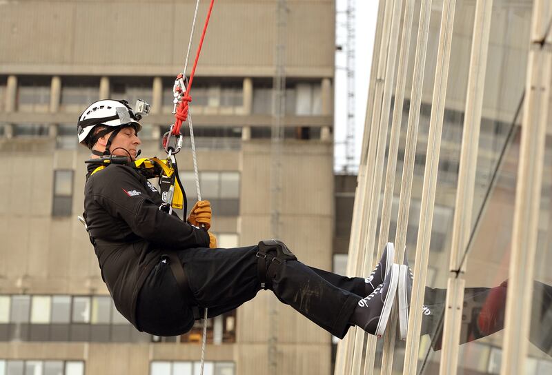 Prince Andrew abseils down the Shard tower in London to raise money for charity in 2012.