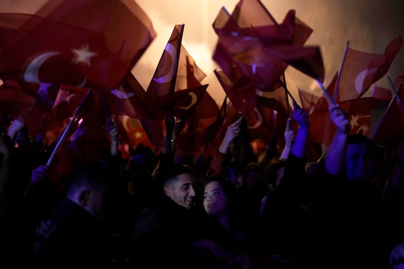 Republican People's Party supporters gather to celebrate local election victory outside City Hall in Istanbul. AP