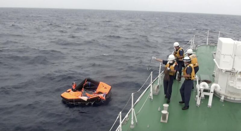 A Filipino crew member of Gulf Livestock 1 is rescued by Japan Coast Guard crew onboard the vessel Kaimon. Reuters