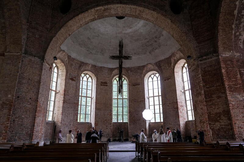Members of the 'House of One' of various religions offer prayers in solidarity with those affected by Covid-19 at the Parochialkirche church in Berlin, Germany.  EPA