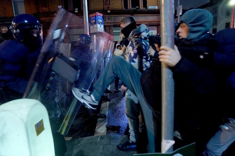 Irish riot police hold the line. PA