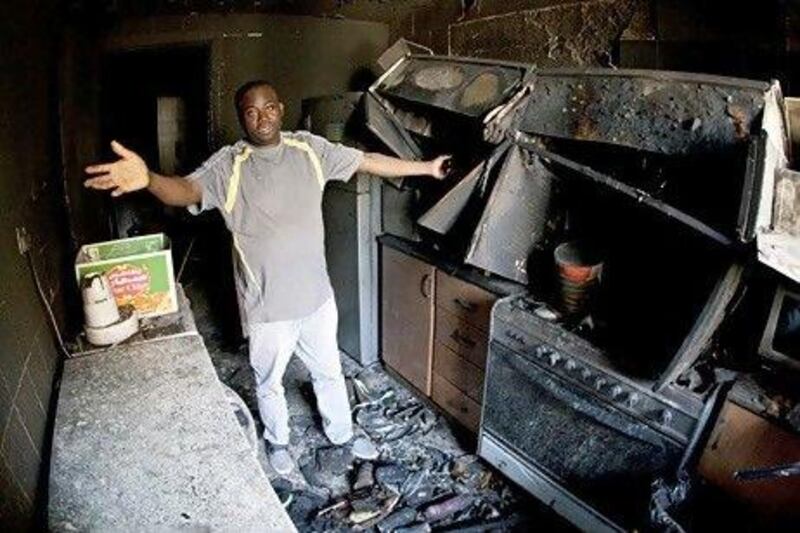 A resident of Al Baker Apartments, in Sharjah, whose apartment was gutted by a fire. Jeff Topping / The National