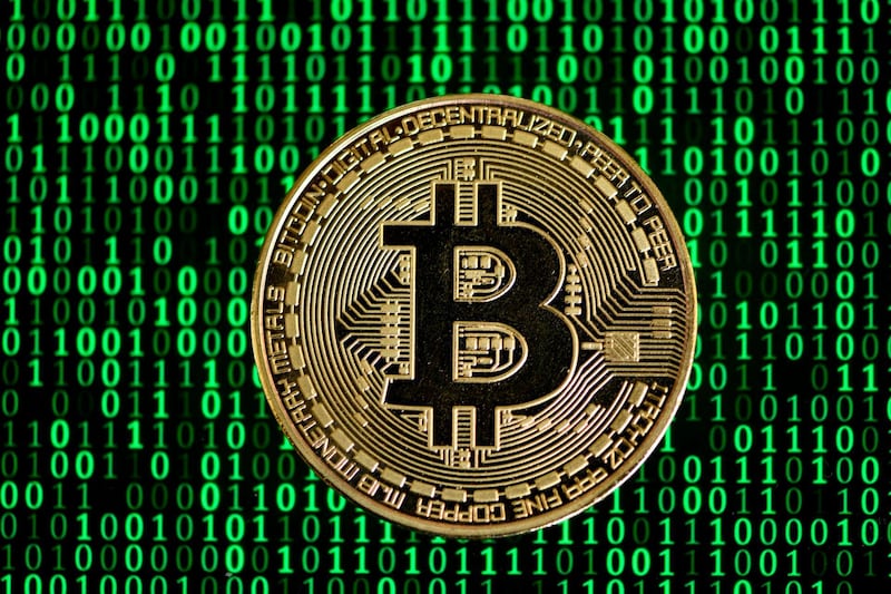 (FILES) In this file photo taken on January 26, 2020 The photo shows a physical imitation of a Bitcoin in Dortmund, western Germany, on January 27, 2020.  Bitcoin miners, whose computer processors enable the running of the world's most popular virtual currency, will soon face a quadrennial event that alters the profitability of the hi-tech industry. So-called "halving" is when bitcoin-mining companies and individuals discover what they will receive in return for their contribution to the system's smooth operation.
 / AFP / INA FASSBENDER / TO GO WITH STORY BY KEVIN TRUBLET

