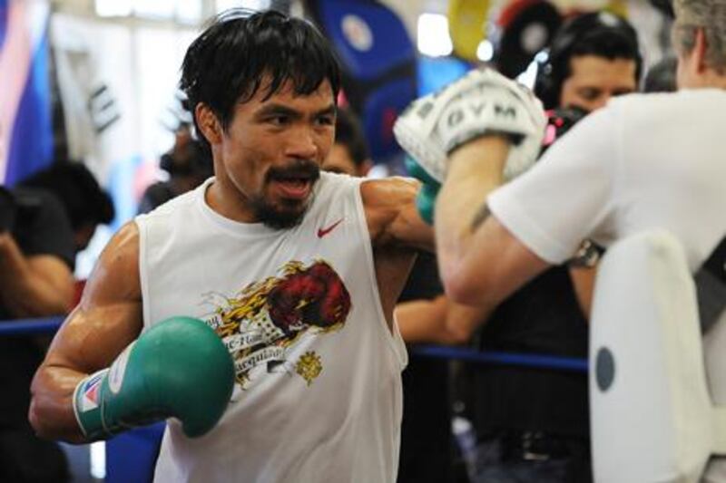 Manny Pacquiao in training ahead of his fight with Juan Manuel Marquez - the two could meet again in Dubai this September.