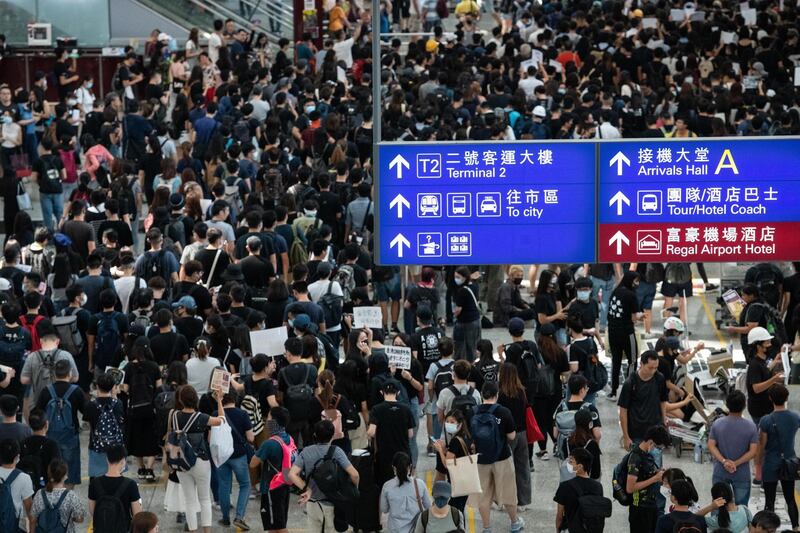 Protesters march against police violence in Hong Kong Chek Lap Kok International Airport, Hong Kong.  EPA