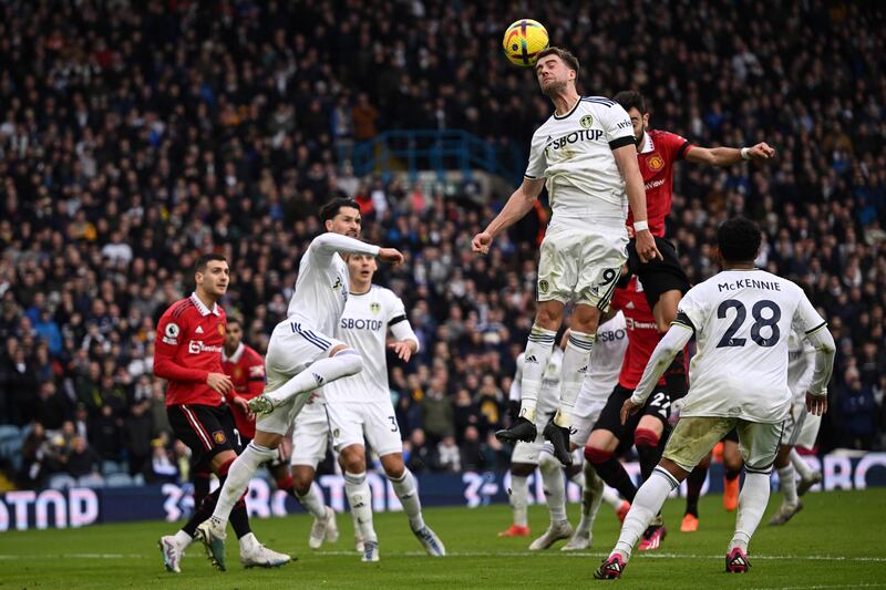 Leeds striker Patrick Bamford wins a header. AFP  