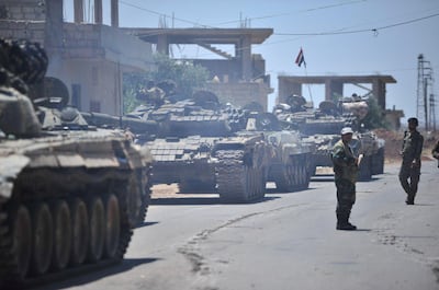 Forces loyal to Syria's President Bashar al-Assad are deployed in al-Ghariya al-Gharbiya in Deraa province, Syria in this handout released on June 30, 2018. SANA/Handout via REUTERS ATTENTION EDITORS - THIS PICTURE WAS PROVIDED BY A THIRD PARTY. REUTERS IS UNABLE TO INDEPENDENTLY VERIFY THE AUTHENTICITY, CONTENT, LOCATION OR DATE OF THIS IMAGE