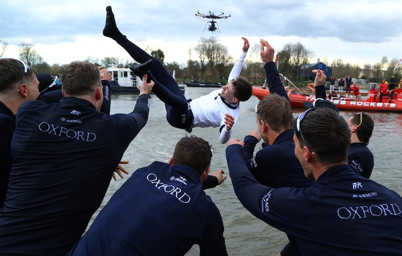 Jack Tottem, the University of Oxford team's coxswain, is thrown into the River Thames after victory over rivals Cambridge in the Gemini Boat Race in London. Getty Images