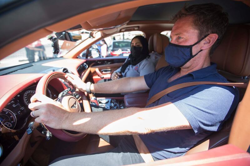 Dubai, United Arab Emirates - Driving instructor Zubeida with a Bentley car instructing Nick Webster at the Emirates Driving Institute, Dubai.  Leslie Pableo for The National