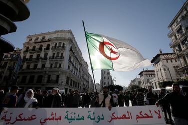 Algerian demonstrators take to the streets in to protest against the government and the upcoming presidential elections, in Algiers, Algeria. AP Photo