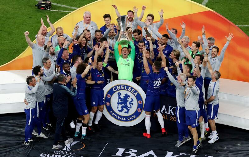 Chelsea's Rob Green and team mates celebrate winning the Europa League with the trophy. REUTERS