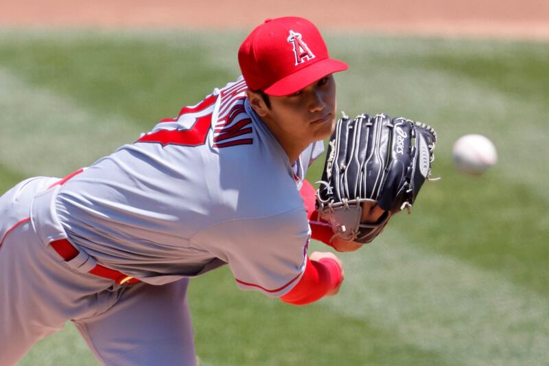 Los Angeles Angels starting pitcher Shohei Ohtani of Japan releases a pitch against the Oakland Athletics during the first inning of the MLB game at the Oakland Coliseum in Oakland, California. EPA