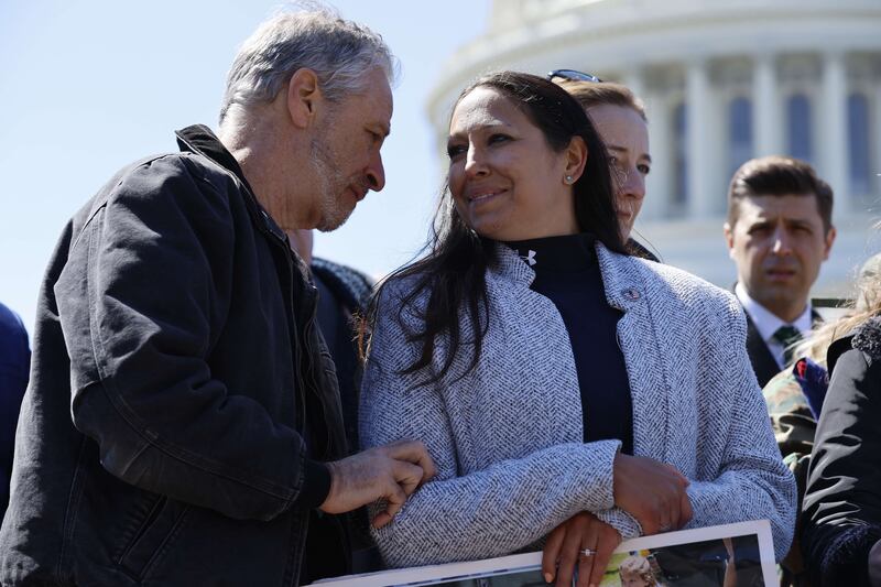 Stewart talks with Ms Robinson outside the US  Capitol in March. Getty Images / AFP
