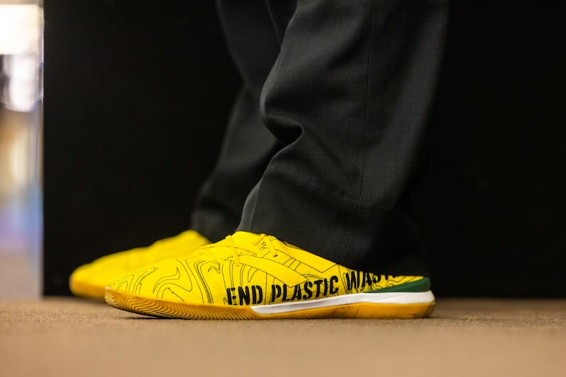 Shoes worn by Rodrigo Oliveira, founder of Brazilian group Green Mining, emphasise support for environmental initiatives. Photo: WEF