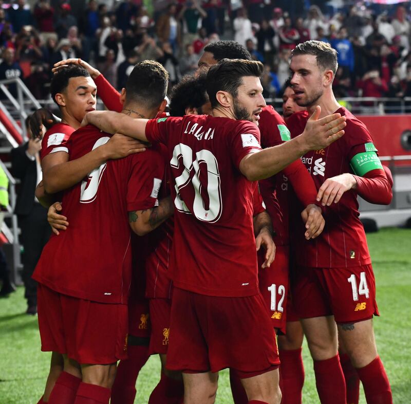 Roberto Firmino (L) celebrates with his Liverpool teammates. EPA