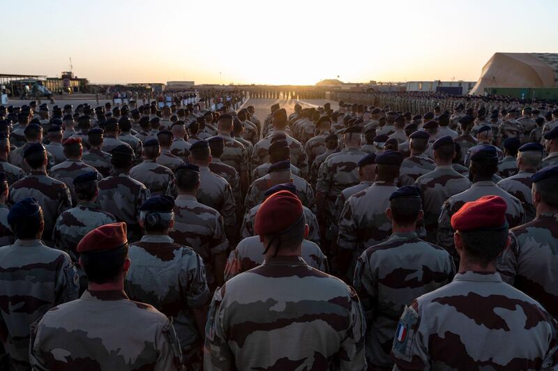 Troops at the French Army base in Gao, Mali, remember the 13 killed in the collision. AFP