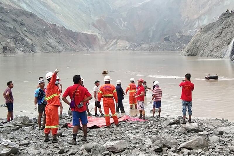 Rescuers attempting to locate survivors after a landslide at a jade mine in Hpakant, Kachin state. AFP