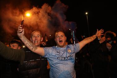 Soccer Football - Champions League - Semi Final Second Leg - Manchester City v Paris St Germain - Manchester, Britain - May 4, 2021 Manchester City fans celebrate outside the Etihad Stadium after reaching the Champions League Final Action images via Reuters/Carl Recine