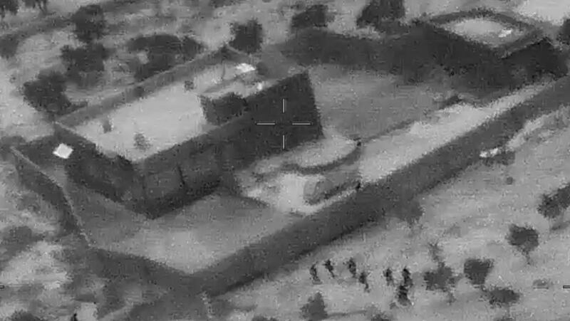epa07961150 A screengrab from a handout military drone video made available by the US Defense Video and Imagery Distribution System (DVIDS) shows the compound of ISIS Leader Abu Bakr al-Baghdadi during the US forces (bottom) raid, northwestern Syria, 26 October 2019 (Issued 30 October 2019). US Forces killed Abu Bakr al-Baghdadi, the founder and leader of ISIS, in northwest Syria on 26 October 2019.  EPA/DVIDS HANDOUT  HANDOUT EDITORIAL USE ONLY/NO SALES