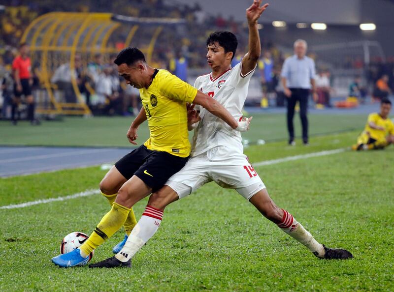 UAE's Mohammed Al Attas, right, challenges Norshahrul Idlan of Malaysia. AP