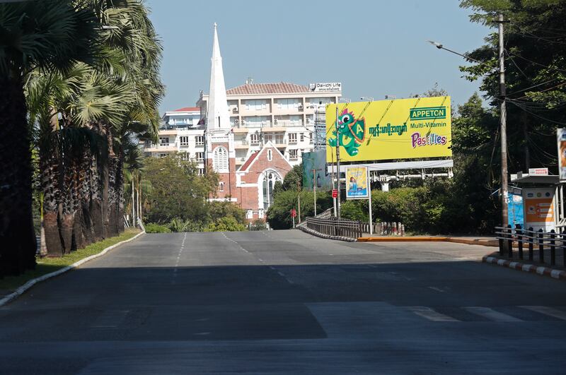 A church at the top of a deserted Yangon street. The silent strike is a protest against military rule, following a coup in February. EPA