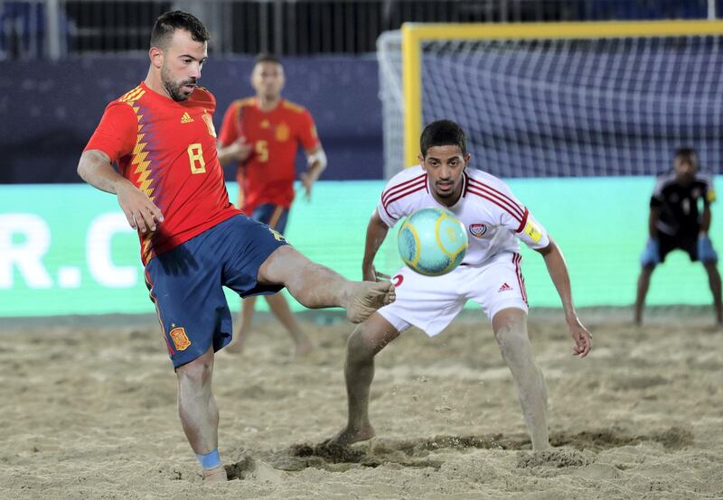 Dubai, United Arab Emirates - November 05, 2019: The UAE's Ahmed Beshr and Spain's Adrian Frutos Garcia battle during the game between the UAE and Spain during the Intercontinental Beach Soccer Cup. Tuesday the 5th of November 2019. Kite Beach, Dubai. Chris Whiteoak / The National