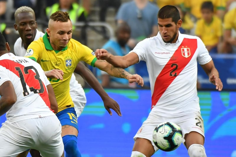 Brazil's Everton Soares, left, and Peru's Luis Abram vie for the ball. AFP