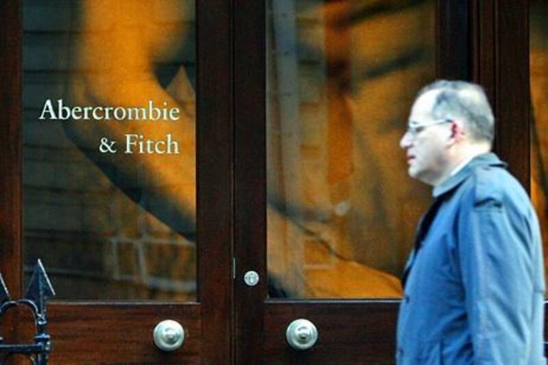 A man walks past the Abercrombie and Fitch store on Savile Row, in London, U.K., on Tuesday, March 11, 2008. After only a year, the retailer's first European venture, near London's Savile Row, charges twice as much as its U.S. stores and has sales of about $4,500 a square foot, matching the main shop on New York's Fifth Avenue, Bear Stearns Cos. said. Photographer: Chris Ratcliffe/Bloomberg News