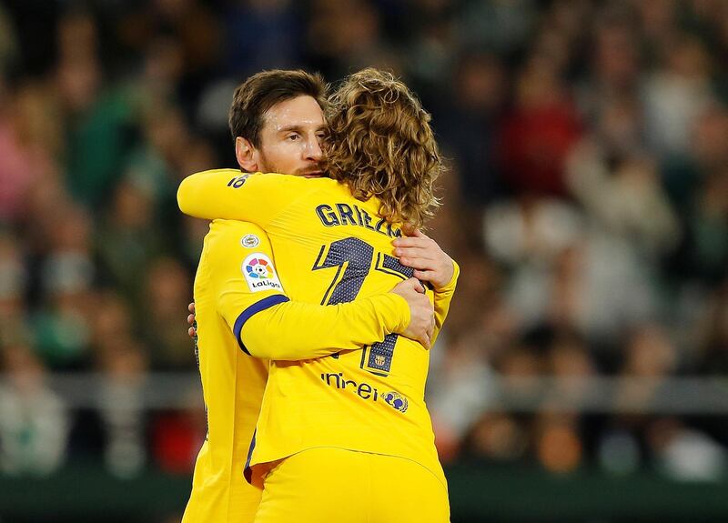 Lionel Messi celebrates with Antoine Griezmann. Reuters