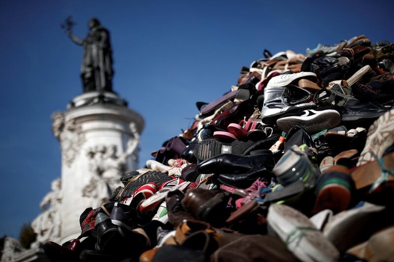 A pile of used footwear is pictured at Place de la Republique during a demonstration organised by International Handicap association to denounce the use and sale of anti-personnel landmines, in Paris, France. Reuters