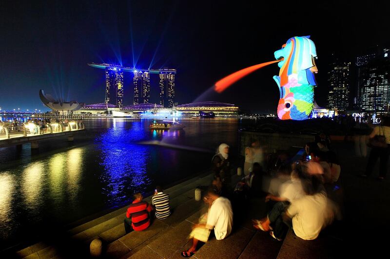 SINGAPORE - MARCH 28: A general view of the Merlion, Marina Bay Sands and the city skyline on March 28, 2012 in Singapore. Singapore expects a slowdown in tourist arrival, with a forecast growth of 2.3 percent in 2012 as compared to 13 percent in 2011, according to the local media. (Photo by Suhaimi Abdullah/Getty Images) *** Local Caption ***  AL12AU-CROWNS-SINGAPORE.jpg