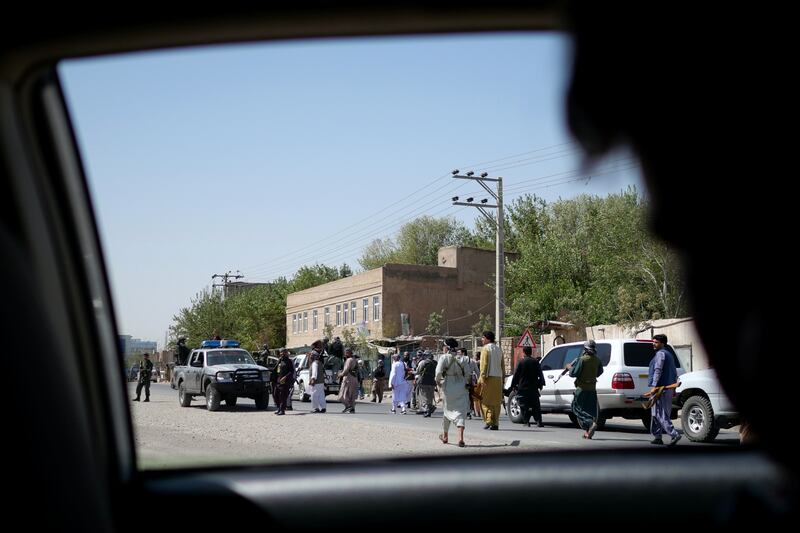 Local fighters arrive at the front line six kilometres from the centre of Herat city to support Afghan government security forces against a Taliban attack.