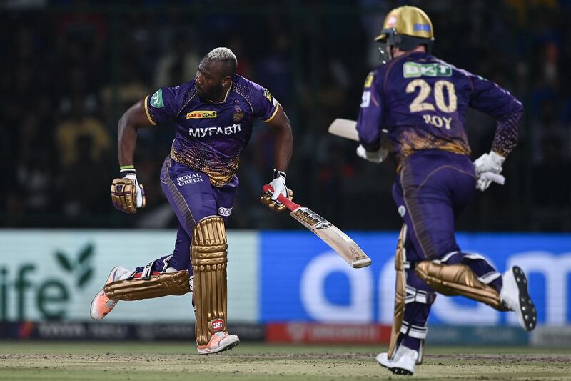 Kolkata Knight Riders' Andre Russell, left, and Jason Roy run between the wickets. AFP