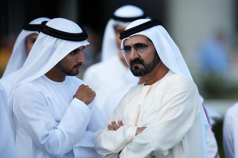 Sheikh Mohammed bin Rashid Al Maktoum , UAE Vice President , Prime Minister and Ruler of Dubai, right, with Sheikh Hamdan bin Mohammed Al Maktoum , Crown Prince of Dubai and other officials at the Meydan Racecourse in Dubai.  Sheikh Mohammed's Godolphin Racing operation were exonerated by the British Racing Authority. Pawan Singh / The National
