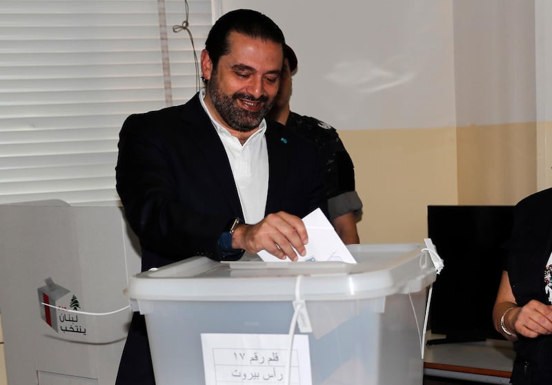 Lebanese Prime Minister Saad Hariri, casts his vote for Lebanon's parliamentary elections, at a polling station, in Beirut, Lebanon, Sunday, May 6, 2018. Lebanon's polling stations have opened for the first parliamentary elections in nine years. (AP Photo/Hussein Malla)
