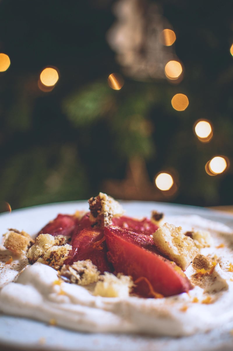 Poached plums with whipped cinnamon labneh. Photo: Scott Price